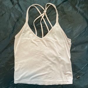 Light pink, semi cropped garage tank top. Light and airy material.